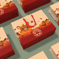 Load image into Gallery viewer, Gift boxes with cartoon deer cat design and red handles on a green background
